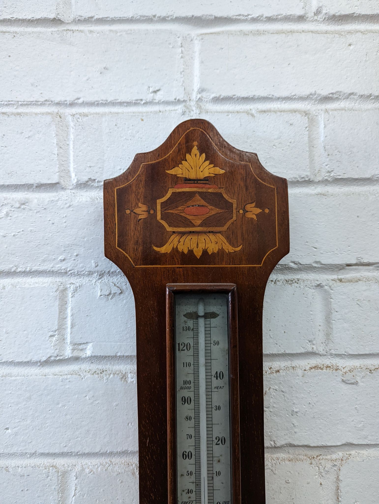 A Victorian marquetry inlaid mahogany aneroid barometer / thermometer, height 82cm